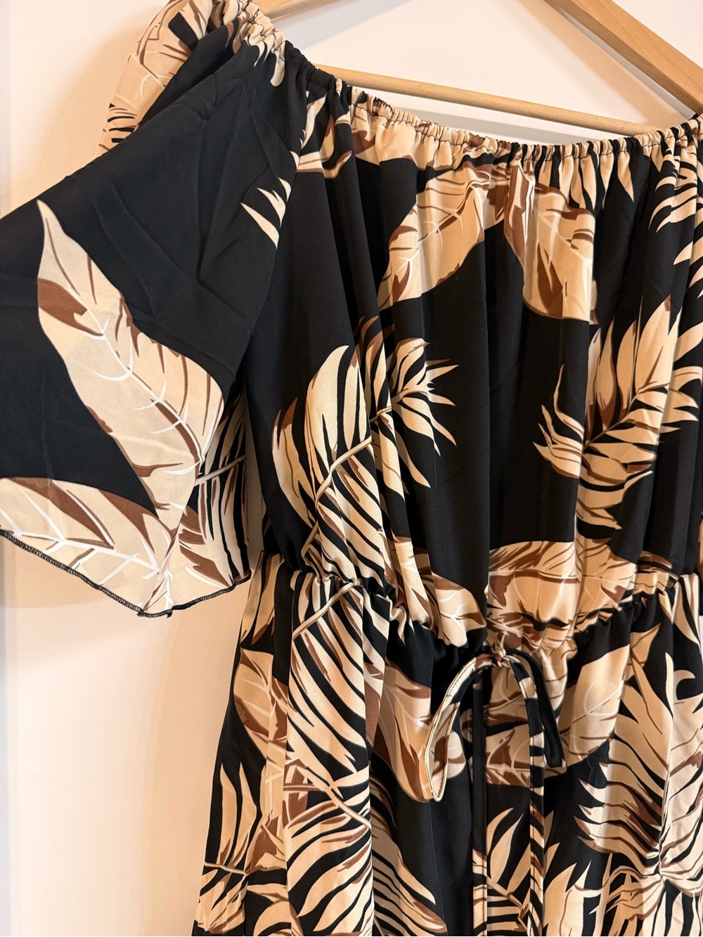Lizzie’s Boutique Off-Shoulder Black and Beige Tropical Print Romper - Picture 2 of 13